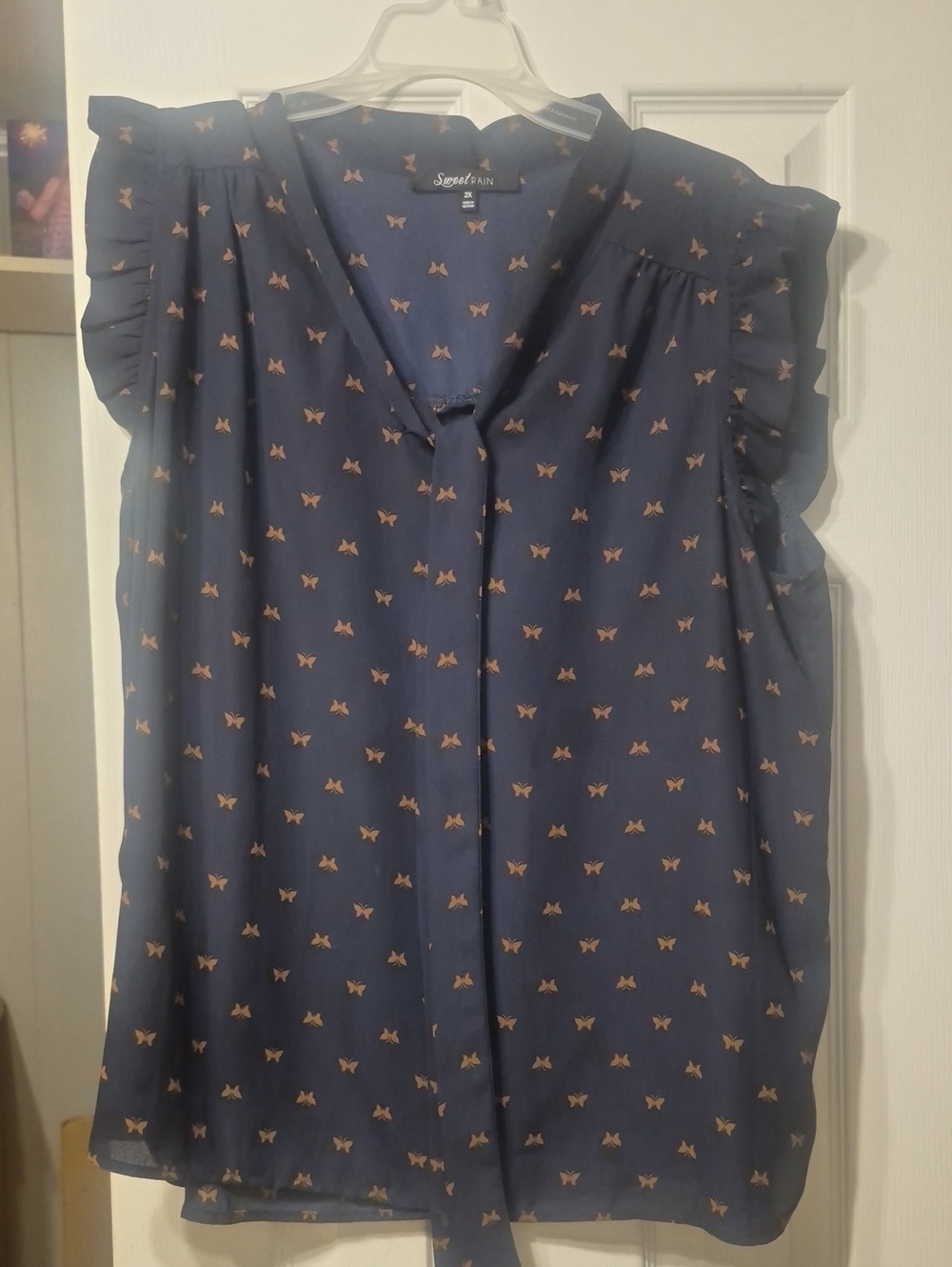 Sweet Rain Navy Blouse with Tan Butterfly Print and Ruffle Cap Sleeves